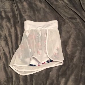 Fabletics white shorts with flower underneath